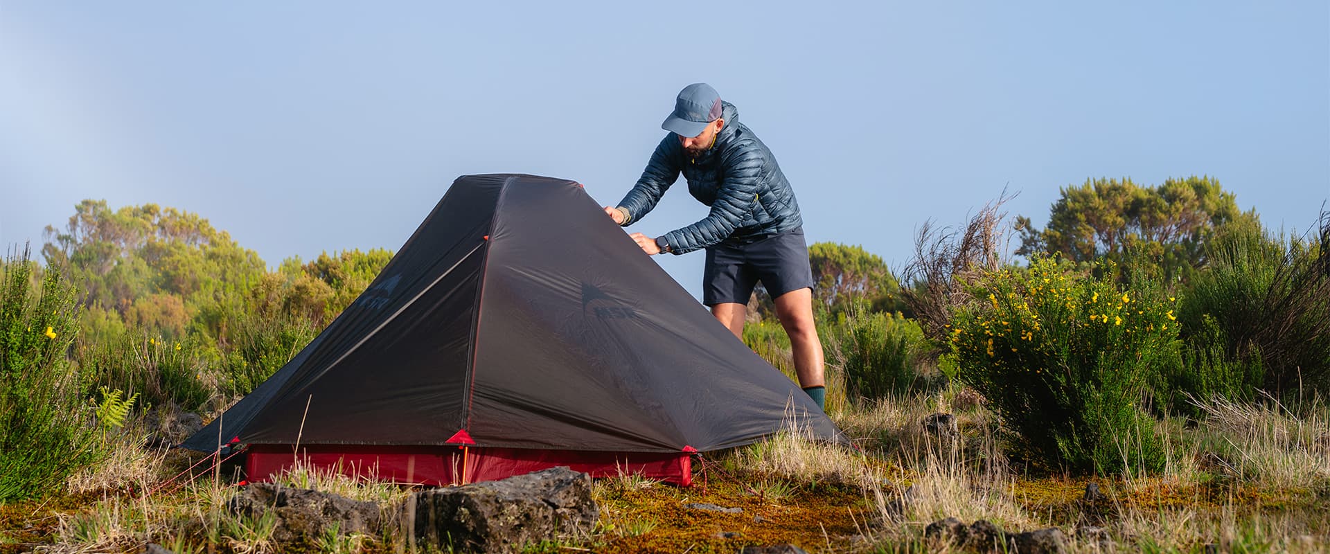 person opening up MSR Hubba Hubba tent