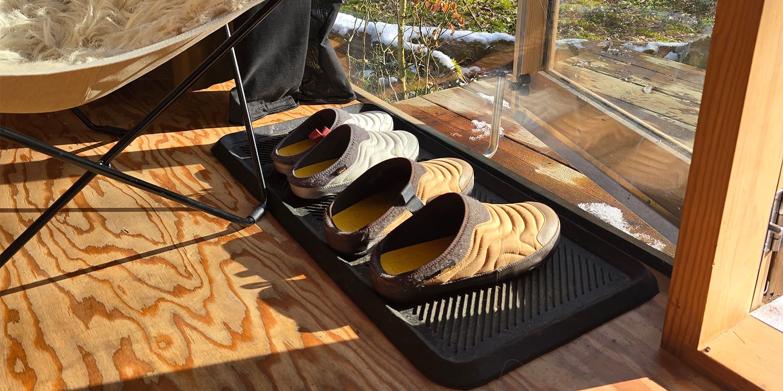 two pair of the Teva ReEmber Terrain shoes in wooden cabin