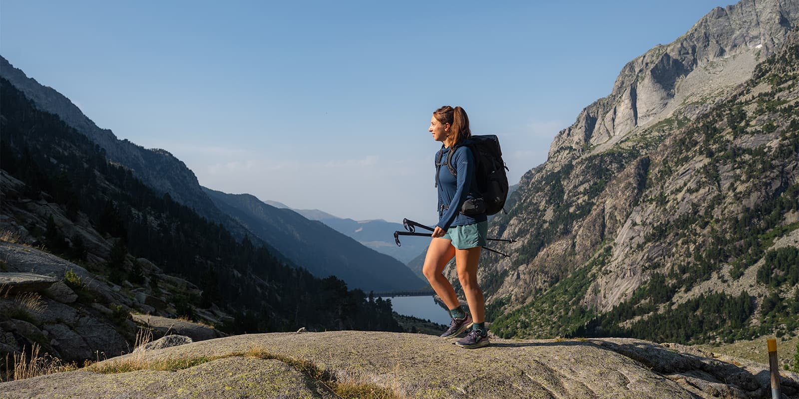person hiking in Aigüestortes National Park on the Via Calda hiking trail