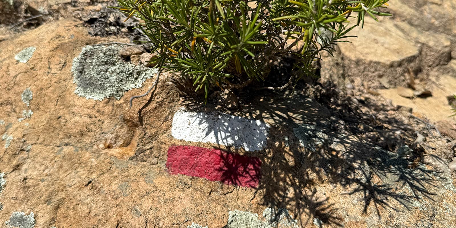 GR hiking trail mark on rock on the Cami de Ronda