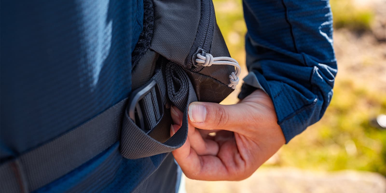 hip strap tucked in hip belt of RAB backpack