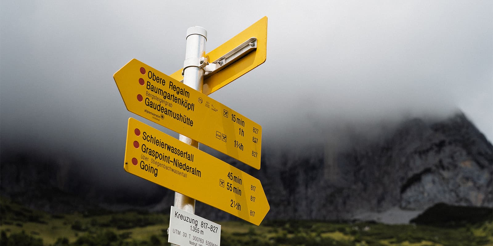 way signs in the Austrian alps on the Adlerweg