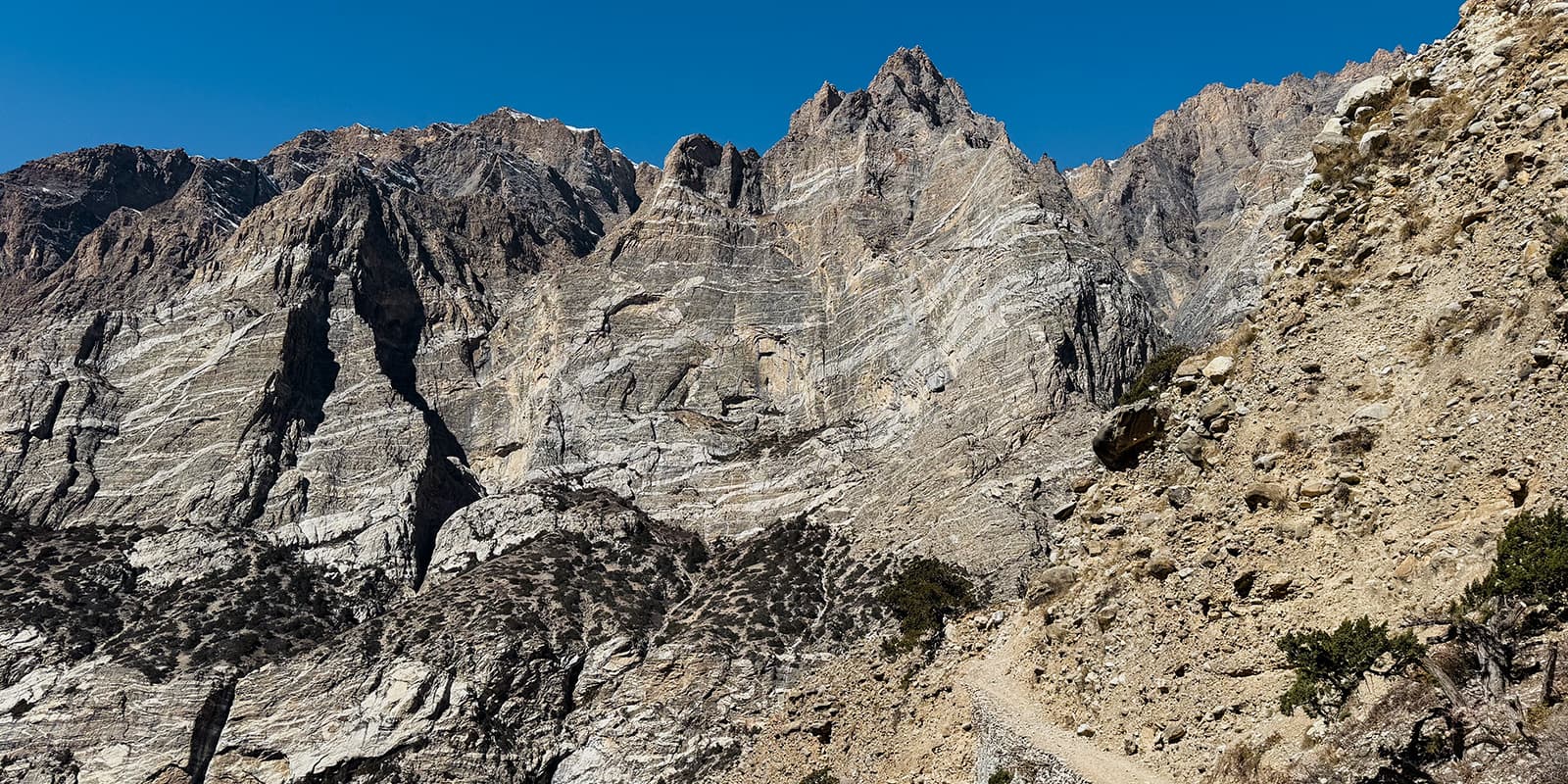 hiking trail close to mountain ridge on the Nar Phu valley trek