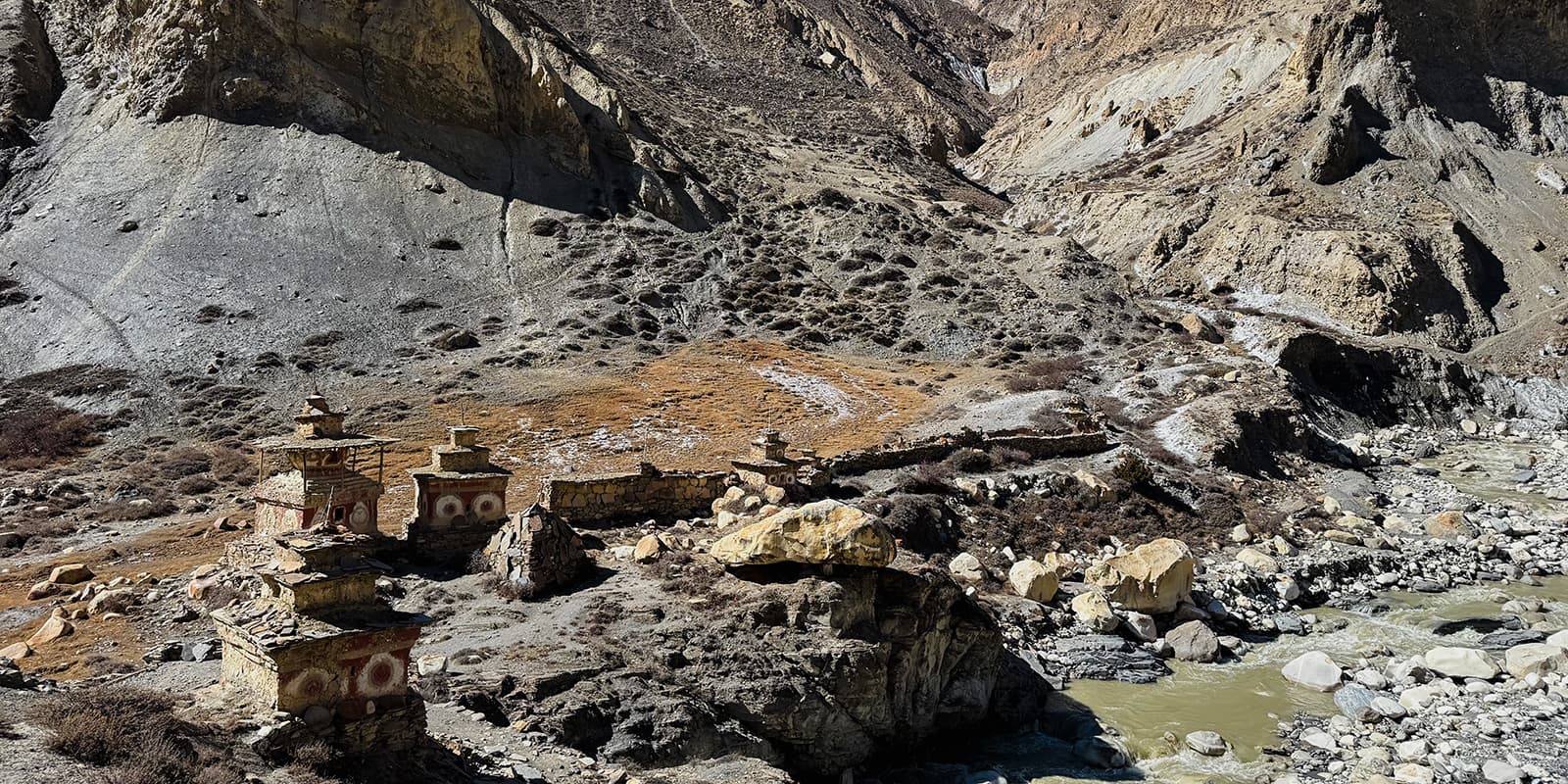 traditional Nepali structures near river in the mountains