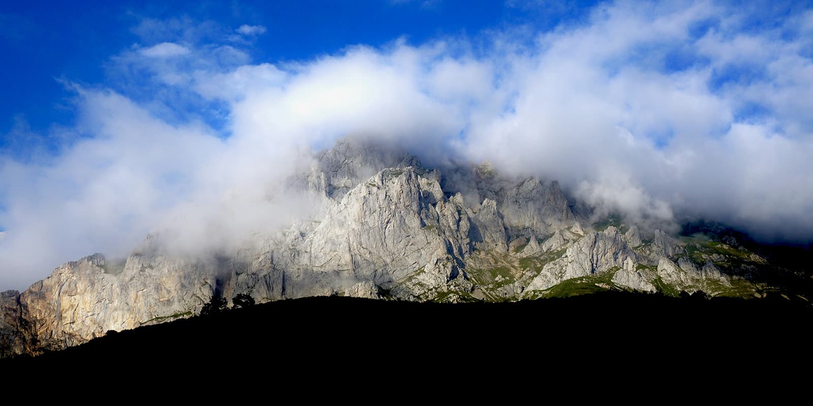 dramatic peaks of Picos de Europa seen on the El Anillo de Picos hiking trail