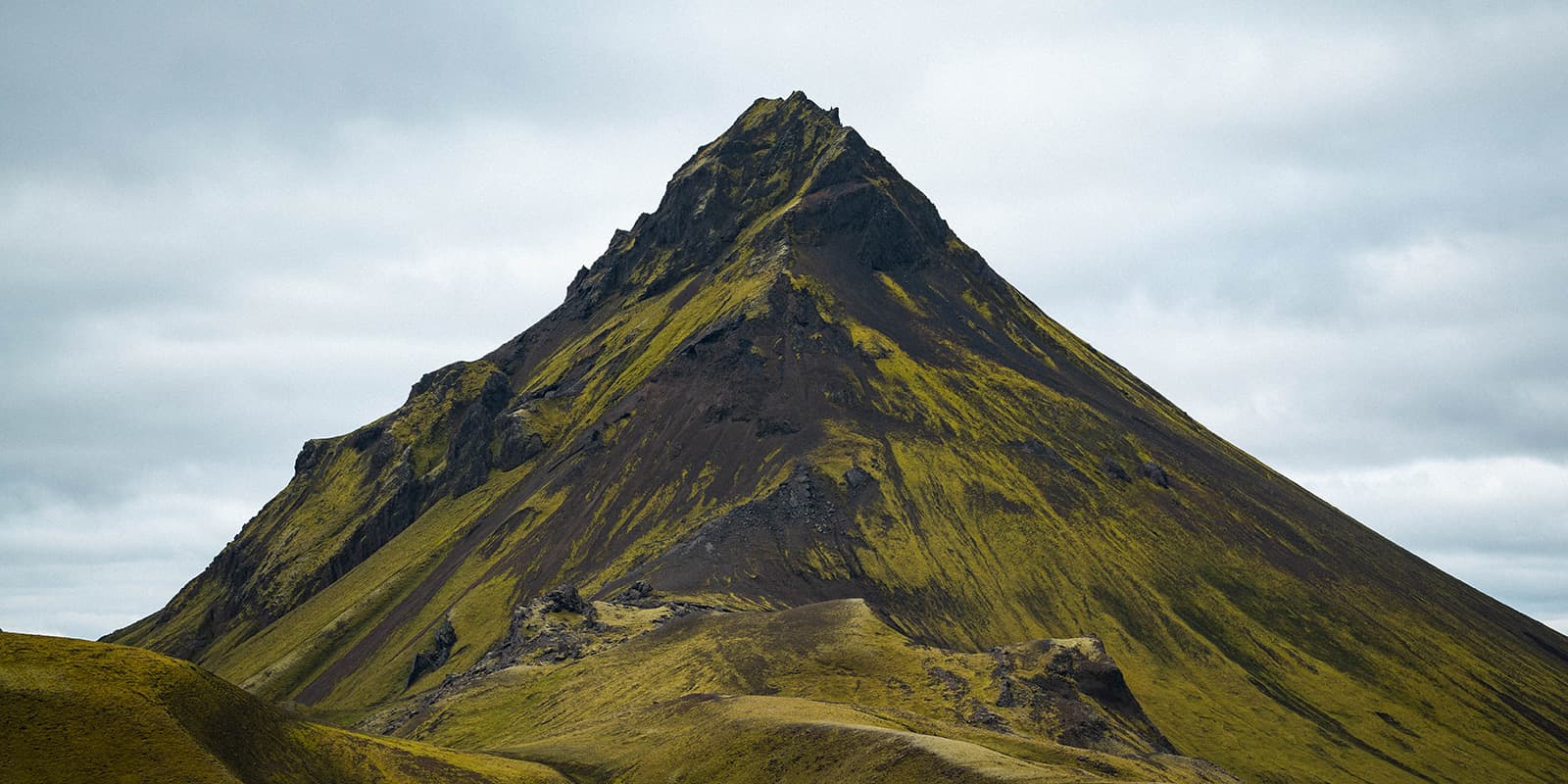 rugged green and black mountain peak in Iceland