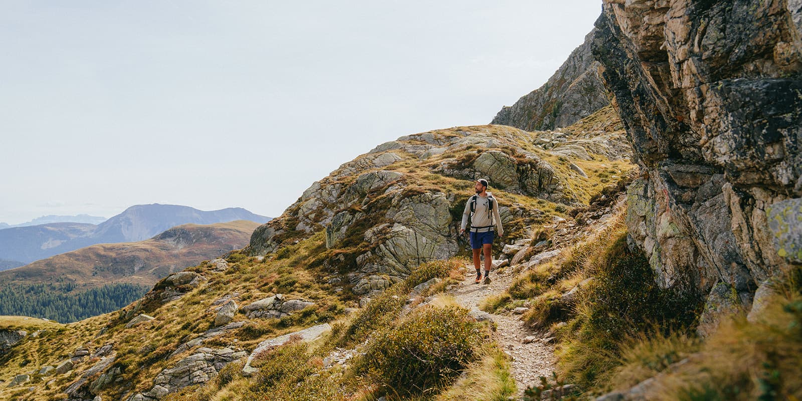person hiking in beautiful mountain landscape